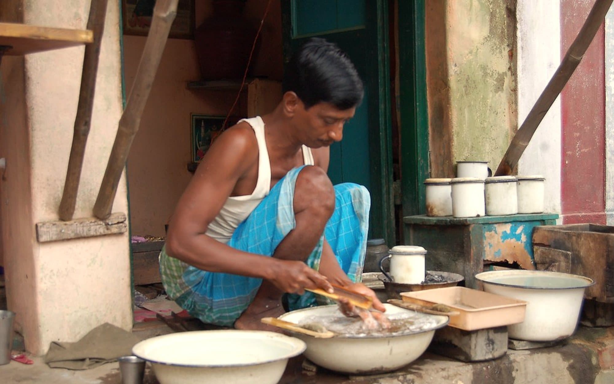 An artisan hand-finishing a sterling silver piece